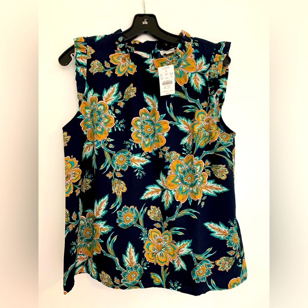 NWT Sleeveless, ruffle neck and sleeves top from J.Crew. Brand new with tags!